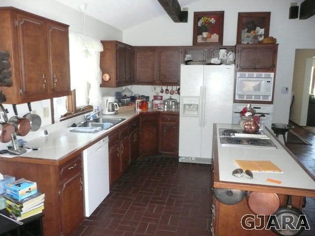1111 Sundial Road Grand Junction, CO 81505 - Photo 4 of 12 a kitchen with a sink stove and refrigerator