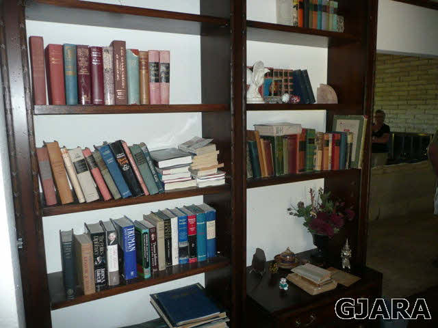 1111 Sundial Road Grand Junction, CO 81505 - Photo 5 of 12 a living room with lots of books and a book shelf