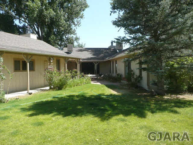 1111 Sundial Road Grand Junction, CO 81505 - Photo 6 of 12 a front view of house with yard and green space