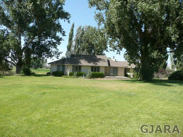 1111 Sundial Road Grand Junction, CO 81505 - Photo 9 of 12 a front view of a house with a garden
