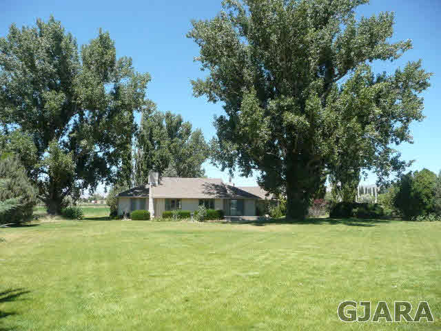 1111 Sundial Road Grand Junction, CO 81505 - Photo 10 of 12 a view of a house with a yard