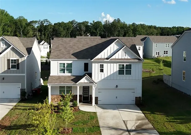 a aerial view of a house with a yard
