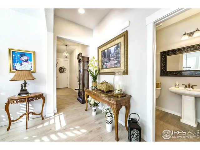a view of a livingroom with workspace and a window