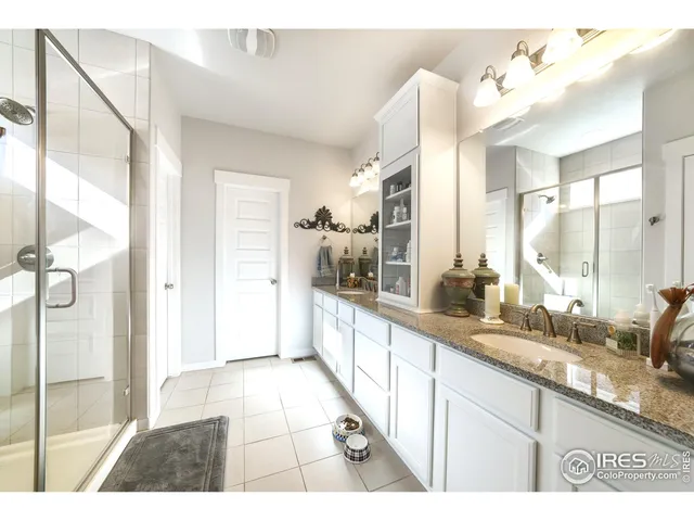 a large white kitchen with a sink