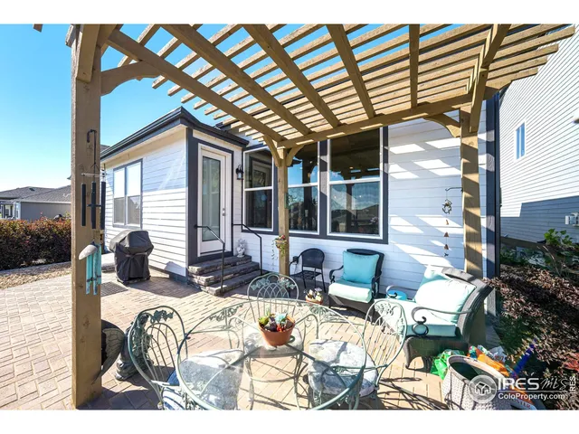 a view of a chairs and table in the patio