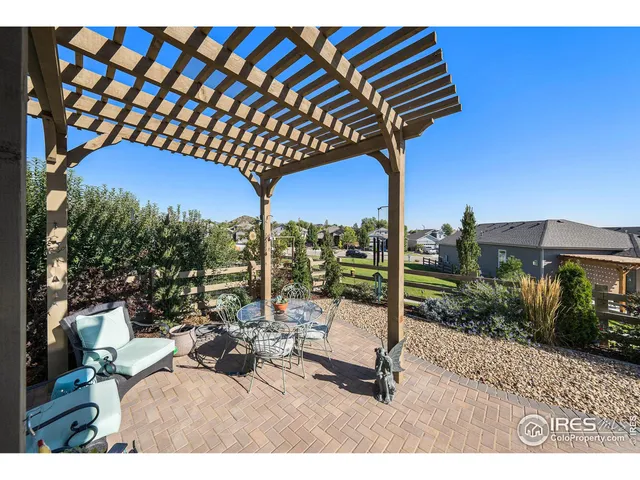 a view of a house with backyard porch and sitting area