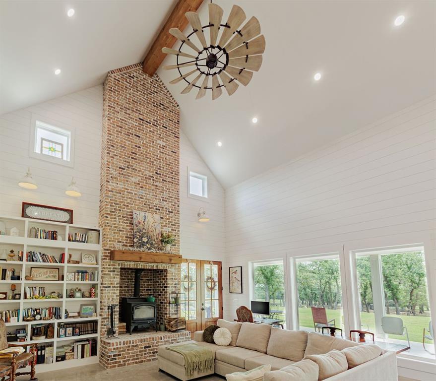 2094 Jim Harry Loop Sunset, TX 76270 - Photo 9 of 40 23 feet high ceiling with library wall