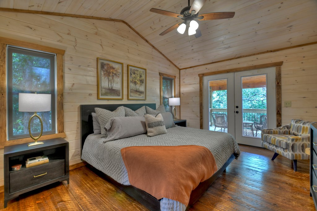 135 Windy Valley Lane Blue Ridge, GA 30513 - Photo 19 of 63 a bed room with bed and a tv