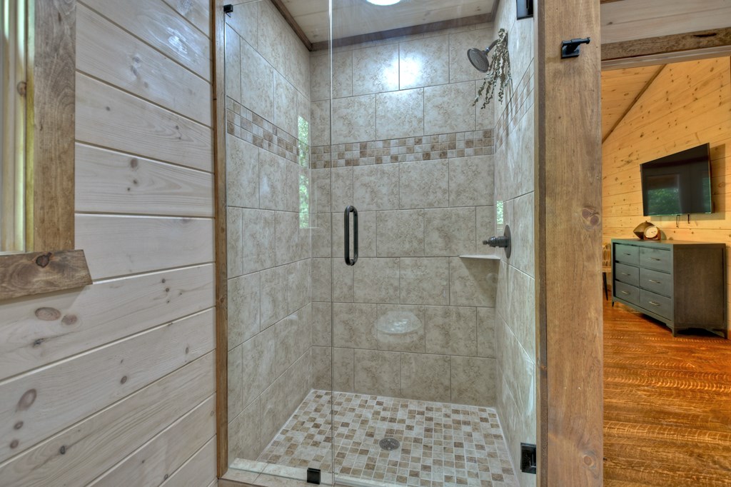 135 Windy Valley Lane Blue Ridge, GA 30513 - Photo 22 of 63 a bathroom with a shower and a sink
