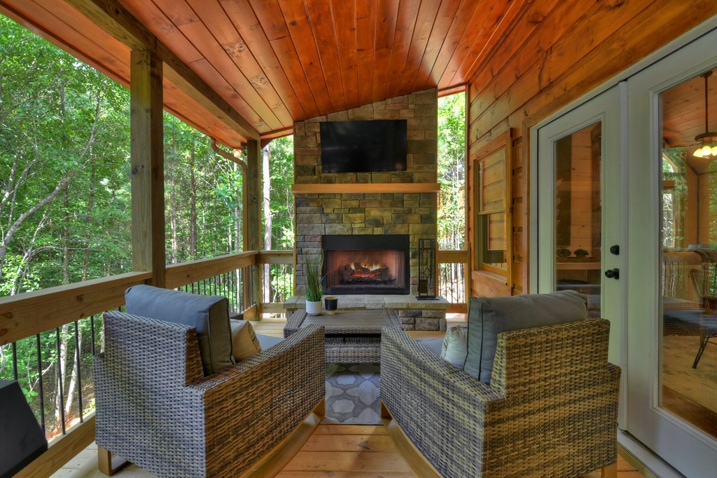 135 Windy Valley Lane Blue Ridge, GA 30513 - Photo 37 of 63 a outdoor living space with furniture and a fireplace