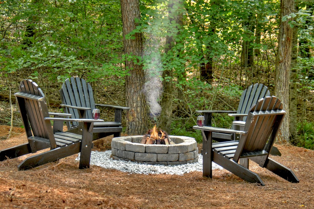 135 Windy Valley Lane Blue Ridge, GA 30513 - Photo 60 of 63 a view of a chairs and tables in the back yard of the house