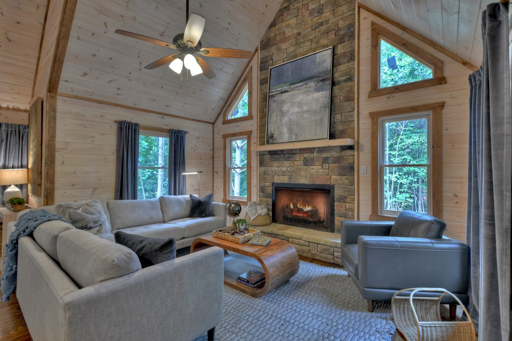 135 Windy Valley Lane Blue Ridge, GA 30513 - Photo 7 of 63 a living room with furniture and a fireplace