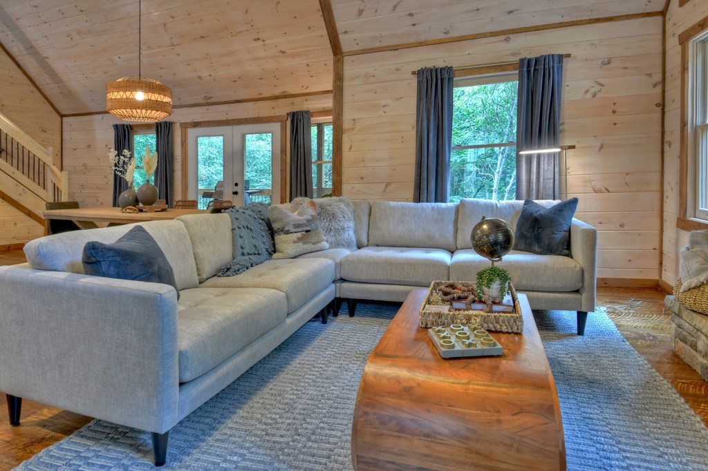 135 Windy Valley Lane Blue Ridge, GA 30513 - Photo 10 of 63 a living room with furniture and a large window