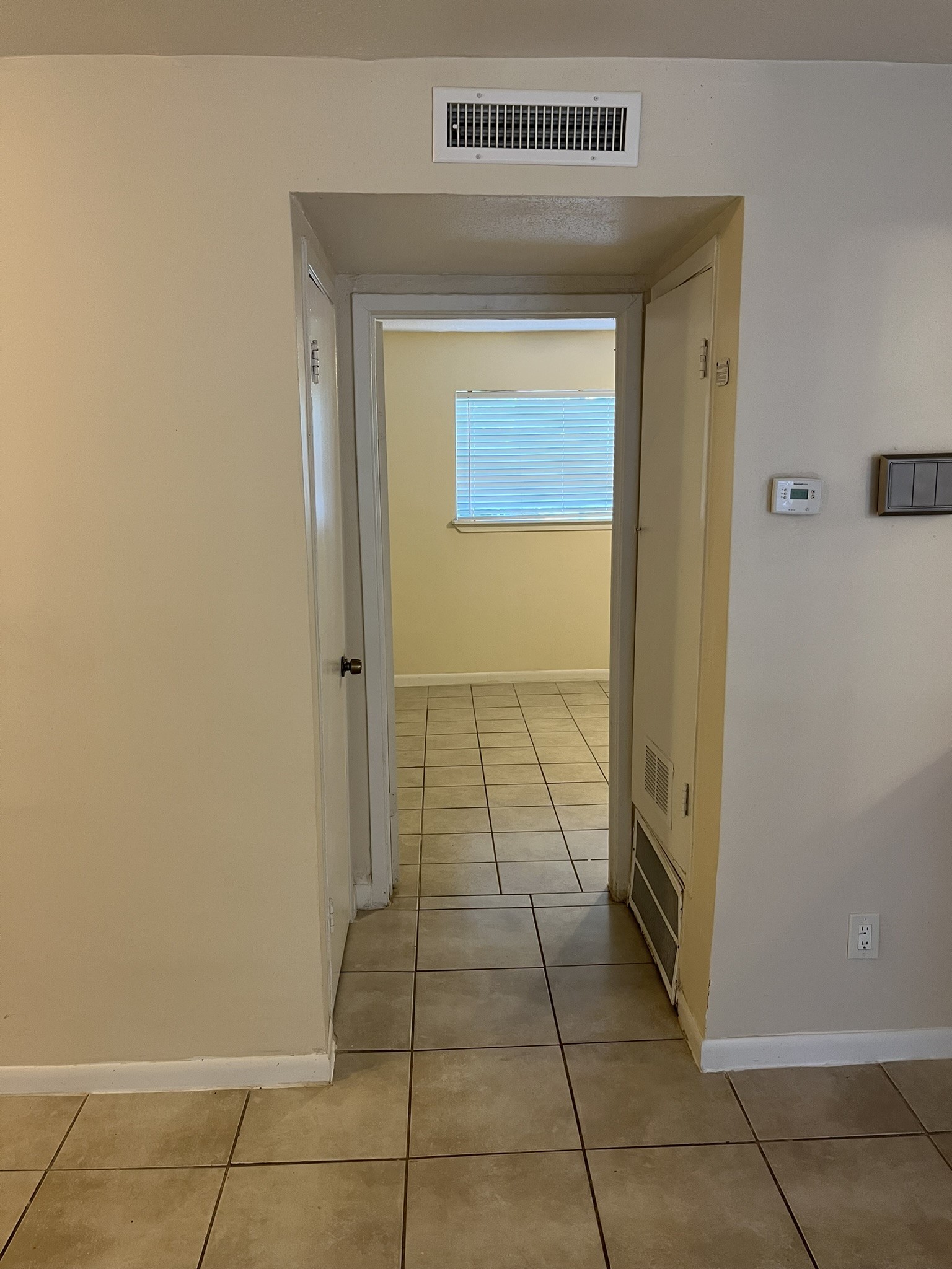 1275 Witte Road, Unit 14 Houston, TX 77055 - Photo 11 of 13 a view of a door and an empty room with a window