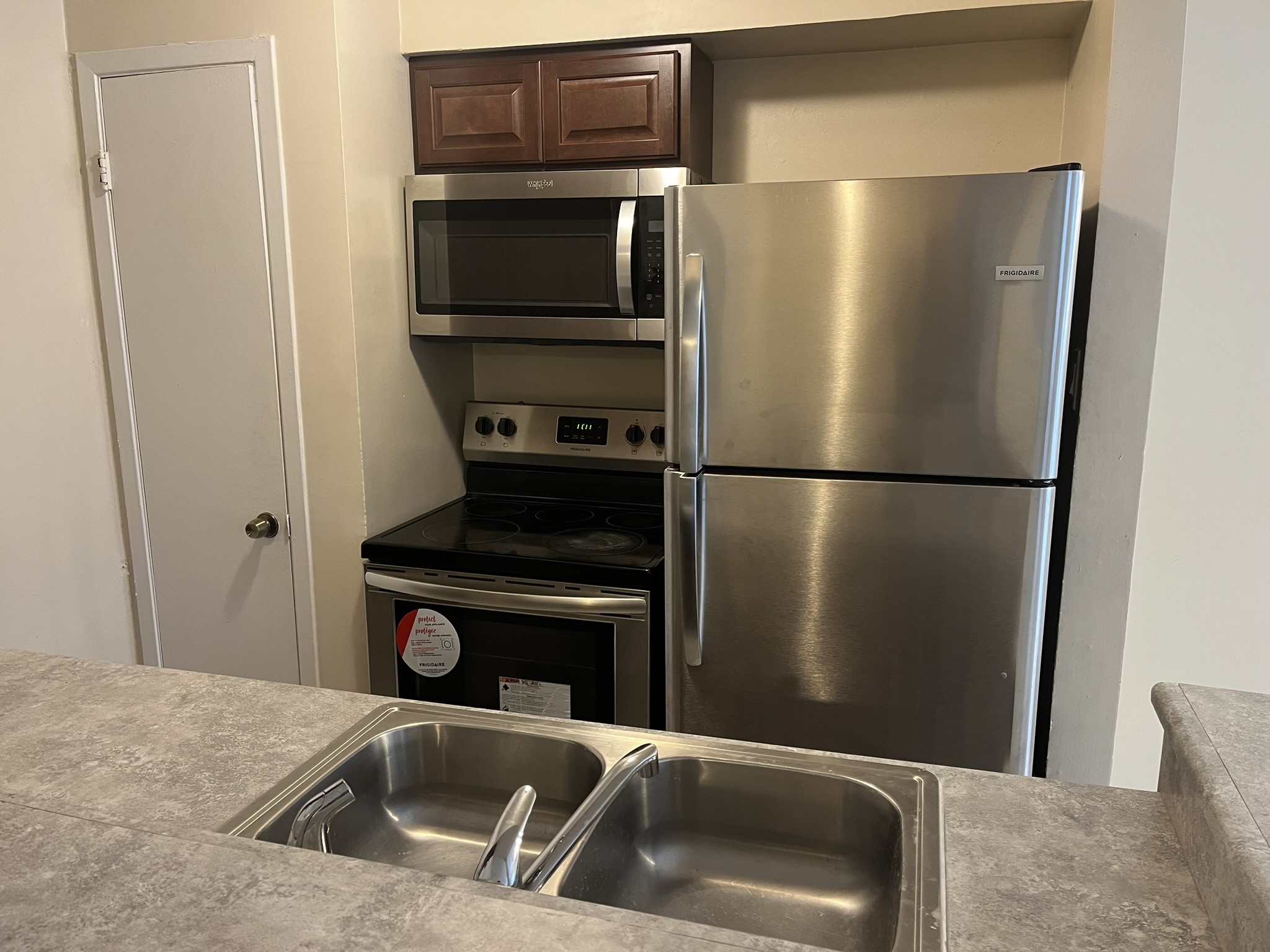 1275 Witte Road, Unit 14 Houston, TX 77055 - Photo 10 of 13 a kitchen with a refrigerator sink and microwave