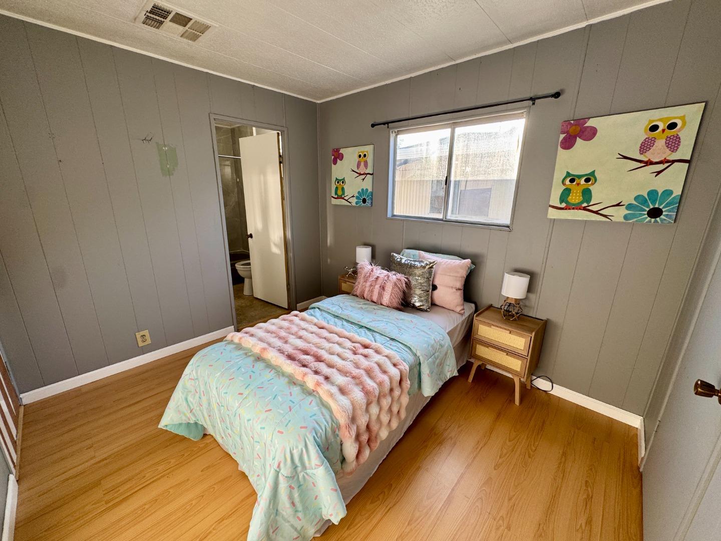 411 Lewis Road, Unit 256 San Jose, CA 95111 - Photo 11 of 12 a bedroom with a bed and a window