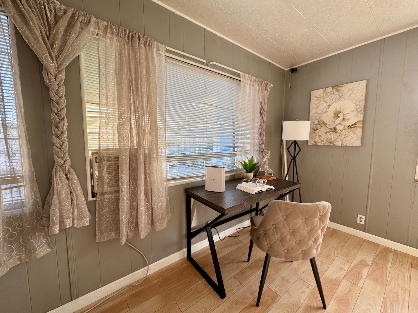 411 Lewis Road, Unit 256 San Jose, CA 95111 - Photo 2 of 12 a view of a workspace with furniture and a window