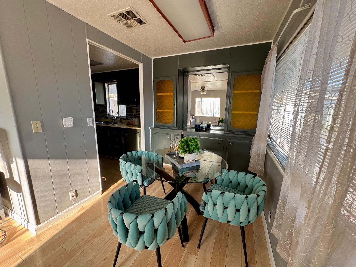 411 Lewis Road, Unit 256 San Jose, CA 95111 - Photo 5 of 12 a living room with furniture and a large window
