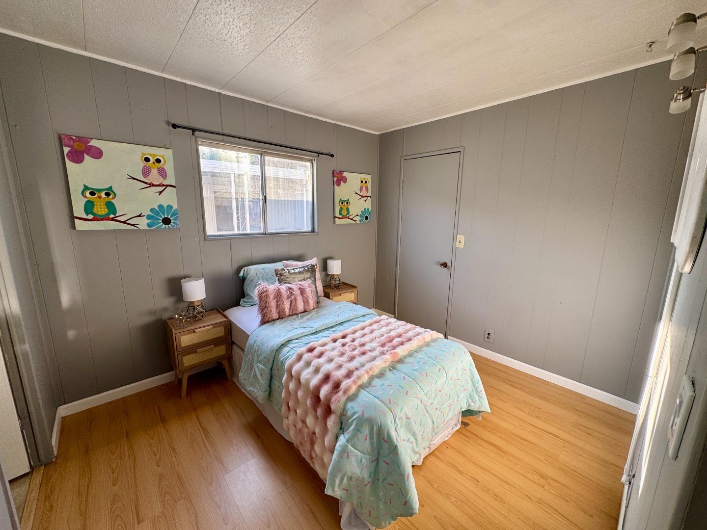 411 Lewis Road, Unit 256 San Jose, CA 95111 - Photo 10 of 12 a bedroom with a bed and a window