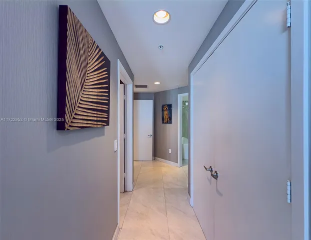 a view of walk in closet with clothes