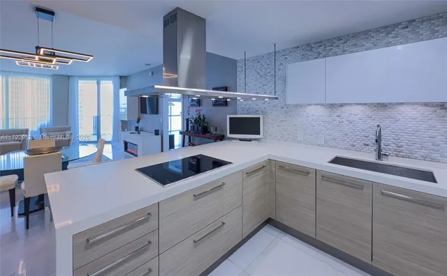 a view of a kitchen counter space with furniture and fireplace