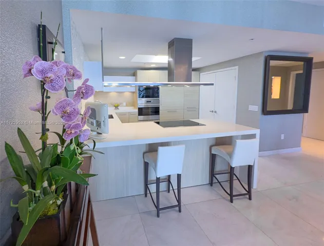 a view of kitchen with cabinets and wooden floor