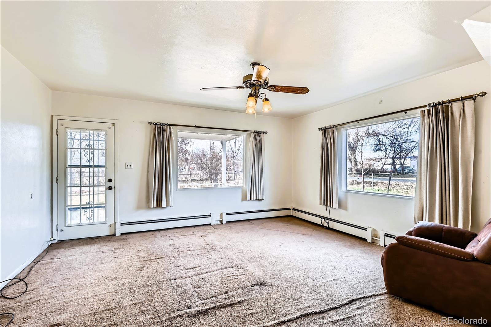 5300 Balsam Street Arvada, CO 80002 - Photo 20 of 29 a view of an empty room with a window and a livingroom