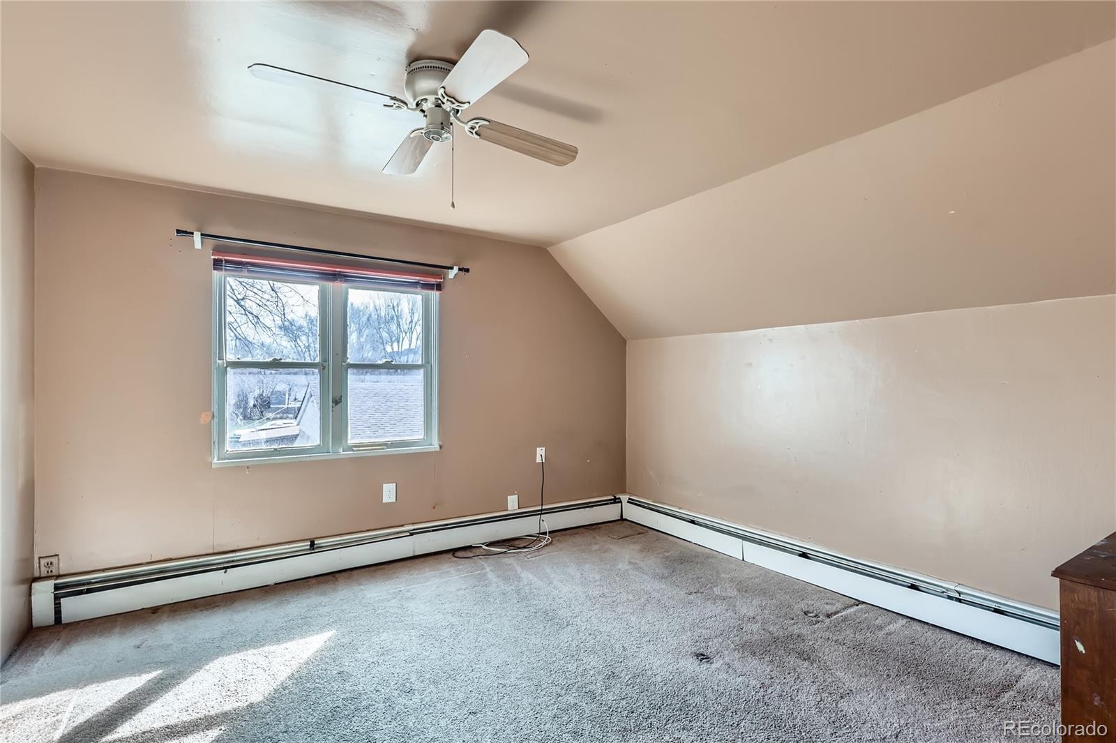5300 Balsam Street Arvada, CO 80002 - Photo 24 of 29 an empty room with a window and a fan