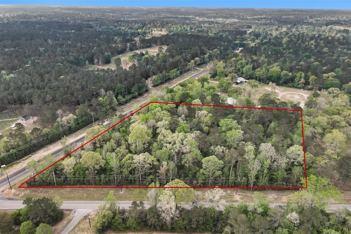 Tbd County Line Road Willis, TX 77378 - Photo 2 of 9 an aerial view of residential houses with outdoor space and trees