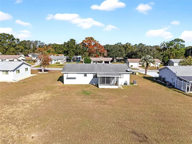 an aerial view of houses with outdoor space