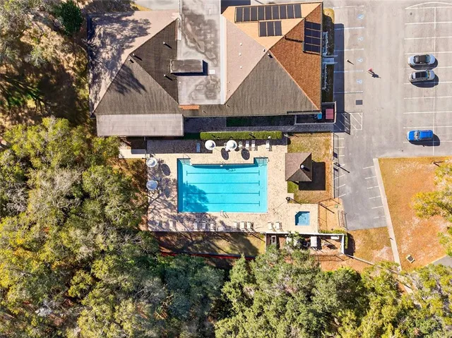 a front view of a house with a yard and fountain