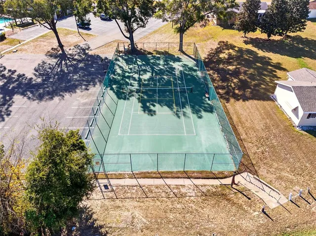 an aerial view of residential house with parking and parking space