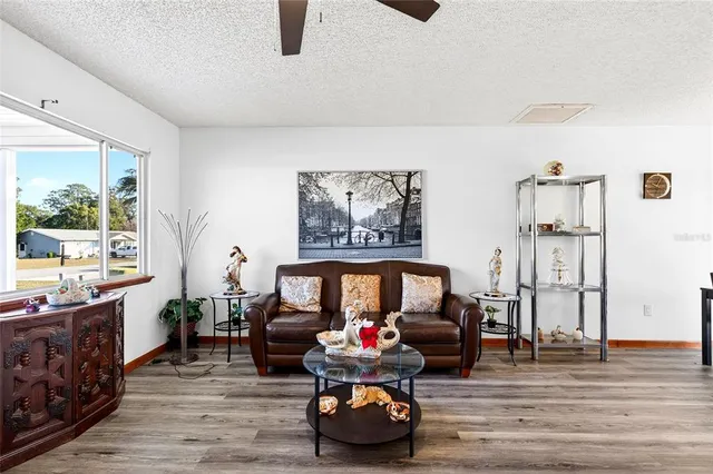 a children room with furniture and wooden floor