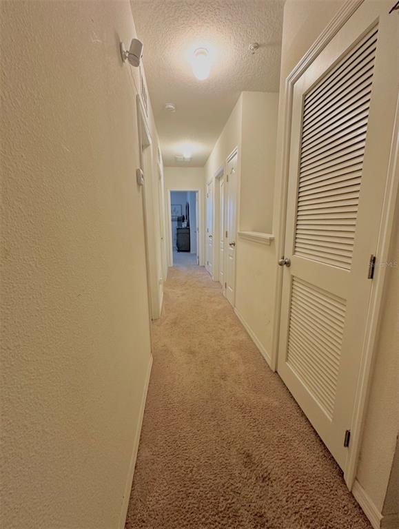 3640 Seneca Club Loop, Unit 46103 Orlando, FL 32808 - Photo 4 of 7 a view of a hallway