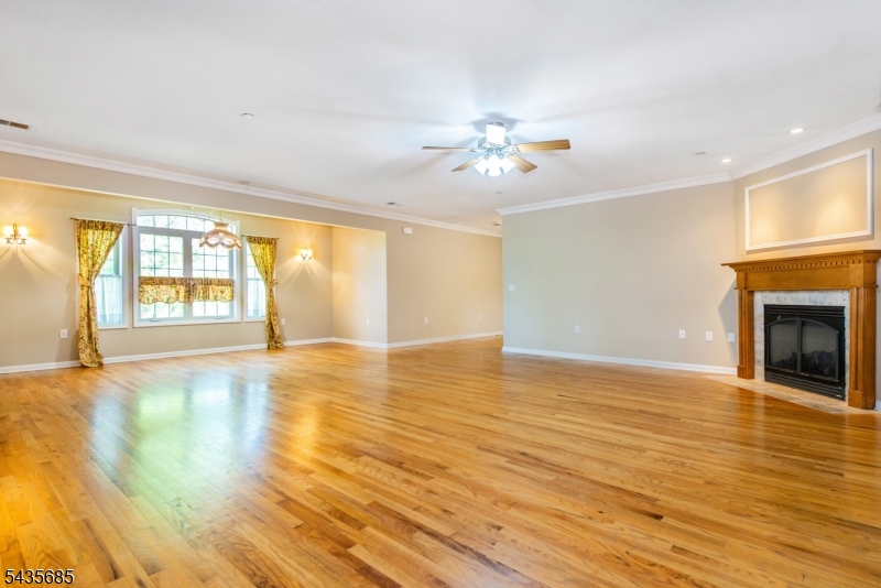 16 Main Street Sparta, NJ 07871 - Photo 14 of 33 a view of an empty room with a window and wooden floor