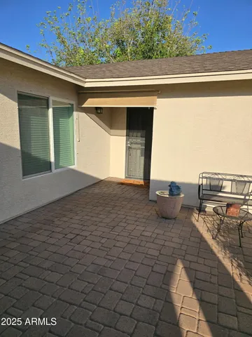 a view of a porch with furniture
