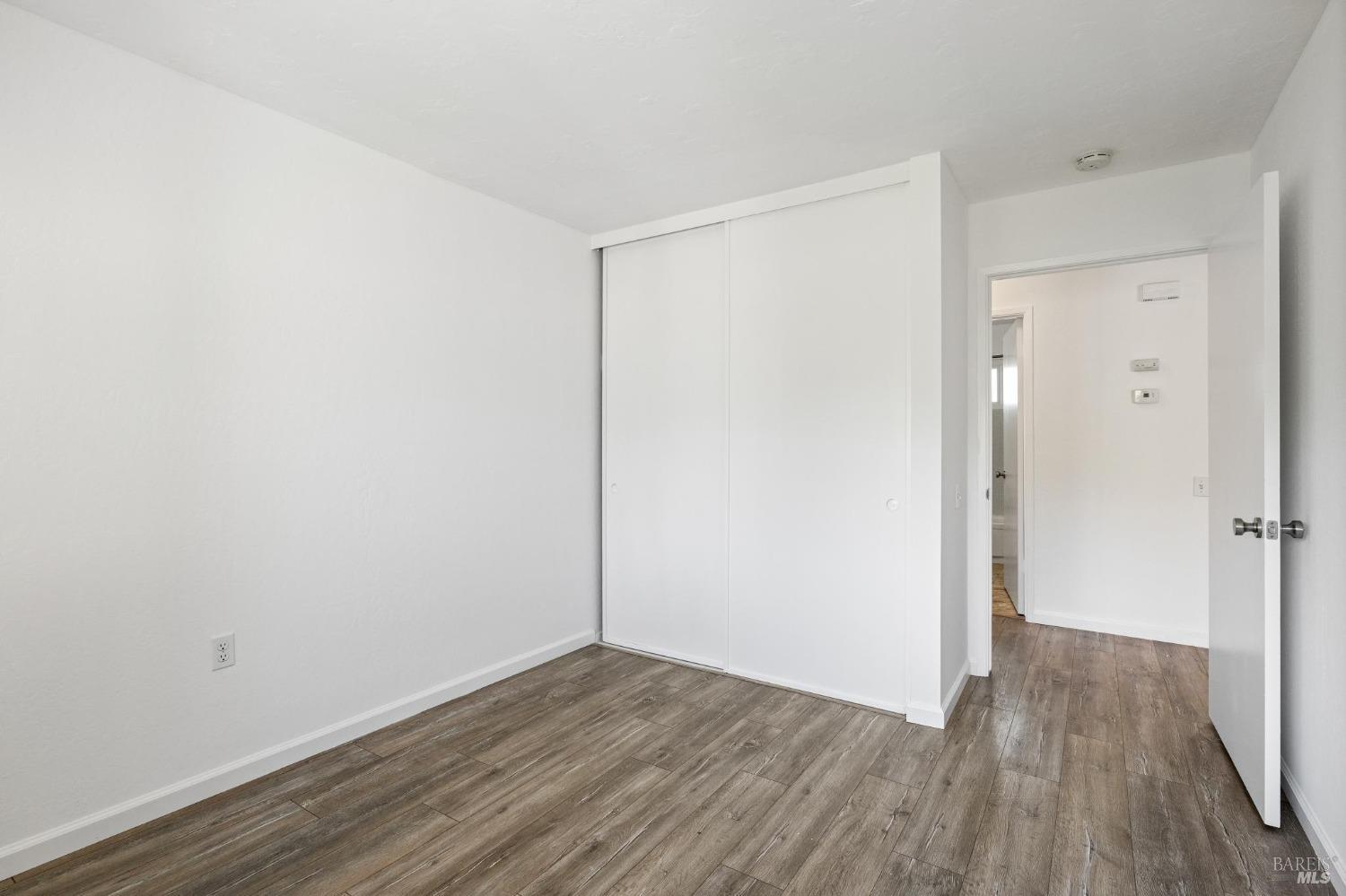 21 Vineyard Circle Sonoma, CA 95476 - Photo 13 of 23 a view of an empty room with wooden floor