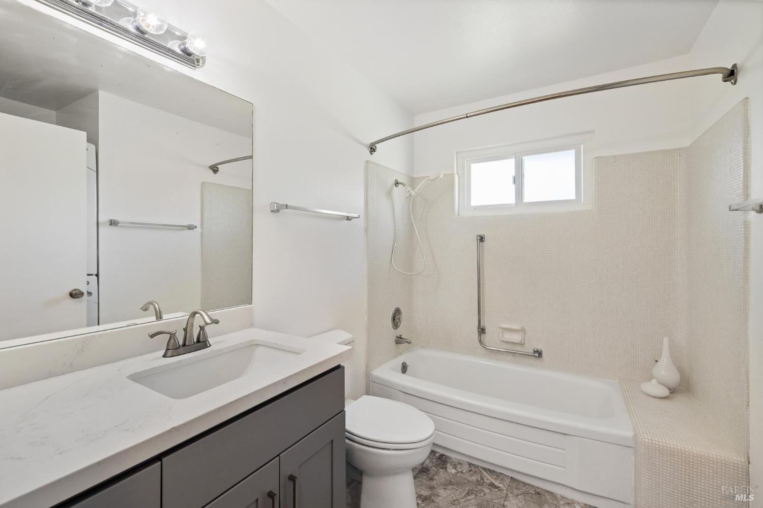 21 Vineyard Circle Sonoma, CA 95476 - Photo 14 of 23 a bathroom with a sink a toilet and a large mirror