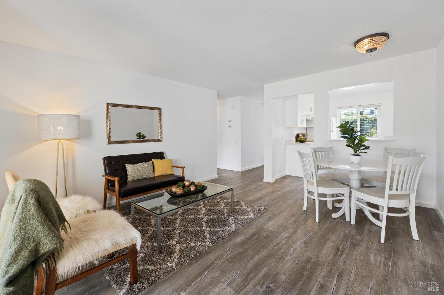 21 Vineyard Circle Sonoma, CA 95476 - Photo 4 of 23 a living room with furniture and a wooden floor