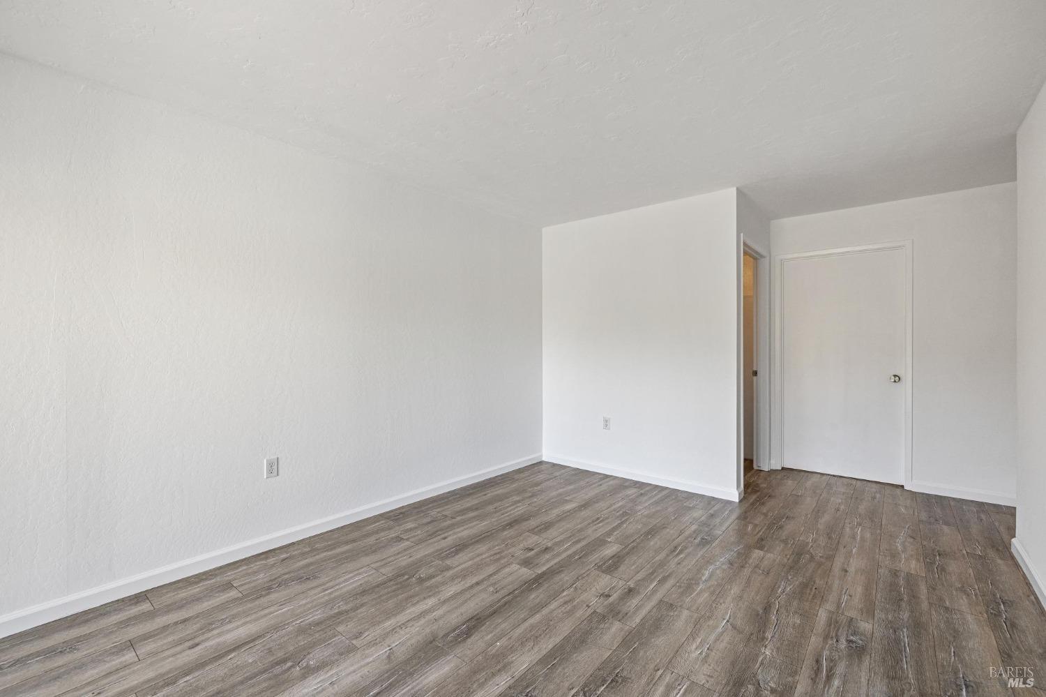 21 Vineyard Circle Sonoma, CA 95476 - Photo 9 of 23 a view of an empty room with wooden floor