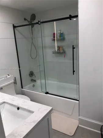 a bathroom with a sink and a shower