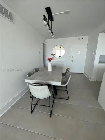 a view of a workspace and a table in a room