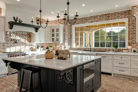 a kitchen with a counter space a sink and appliances