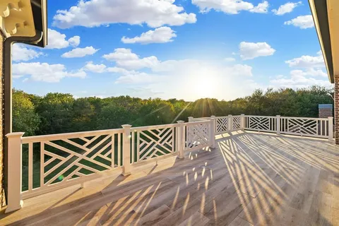 a view of street with wooden fence