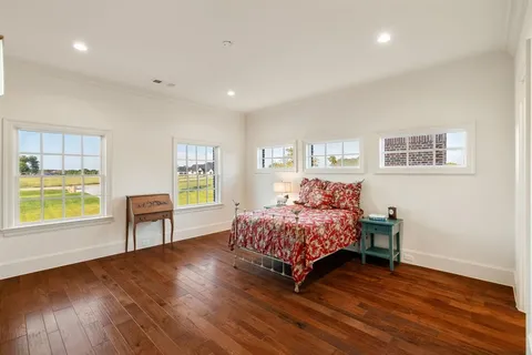 a bed room with a bed and a window