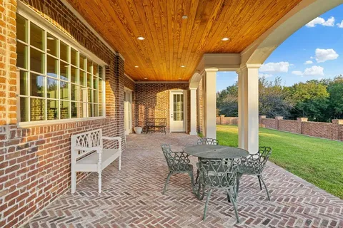 a view of a house with backyard and a chair