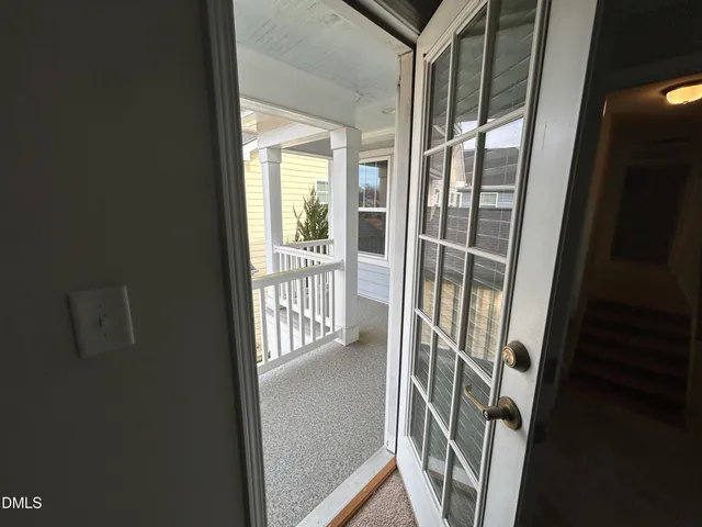 a view of entryway with a floor to ceiling window