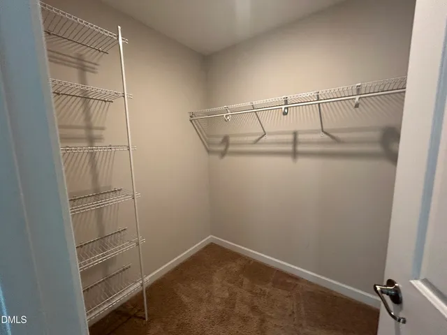 a bathroom with a tub a sink and a large mirror