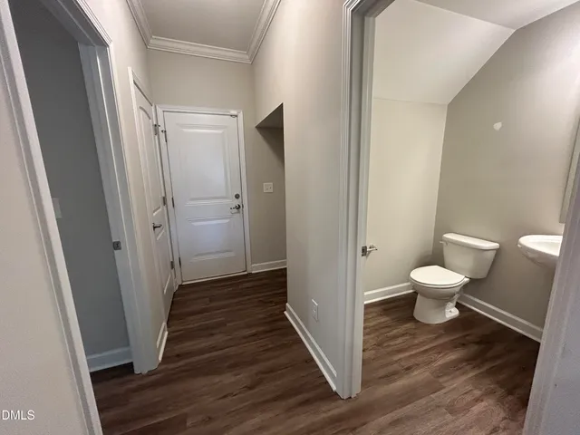 a view of a bathroom from a hallway