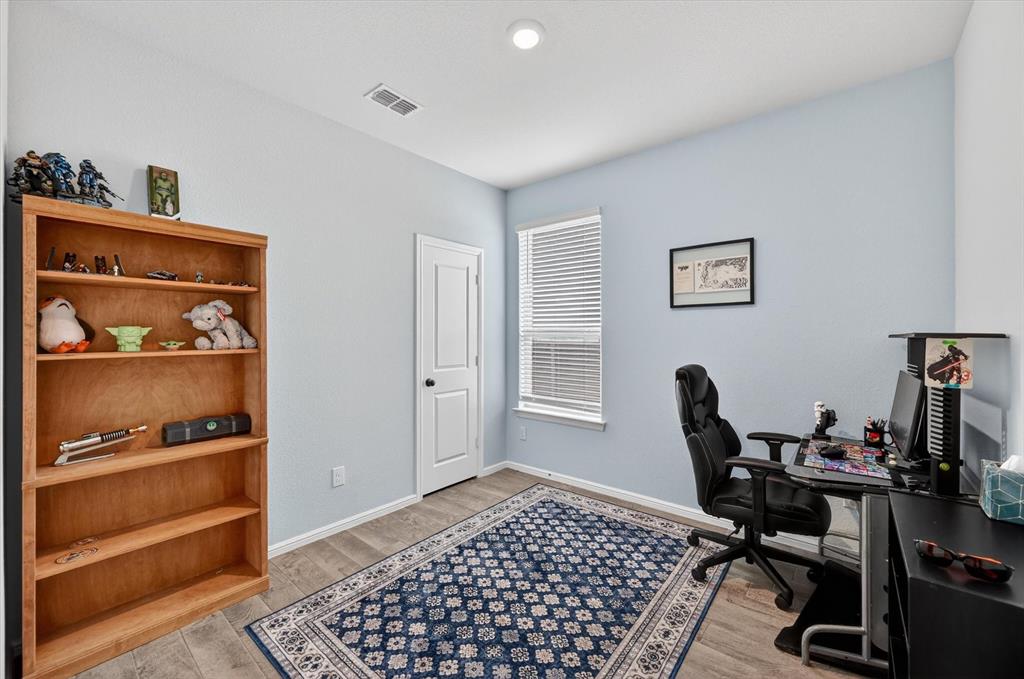9604 Cherryville Road Fort Worth, TX 76108 - Photo 29 of 40 Spacious room featuring light-toned walls and wood-finish flooring